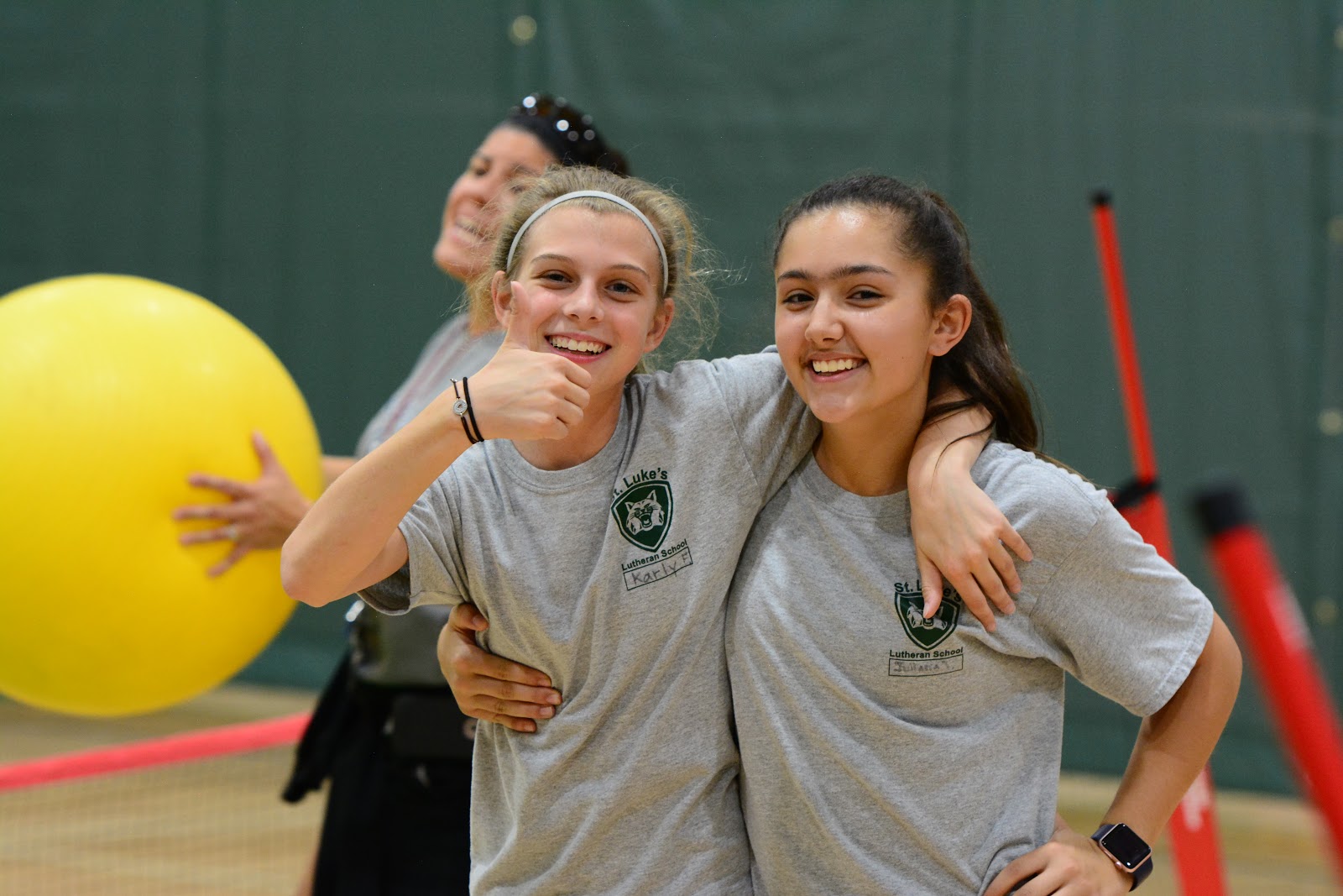 Two Middle Schoolers Smiling During P.E.